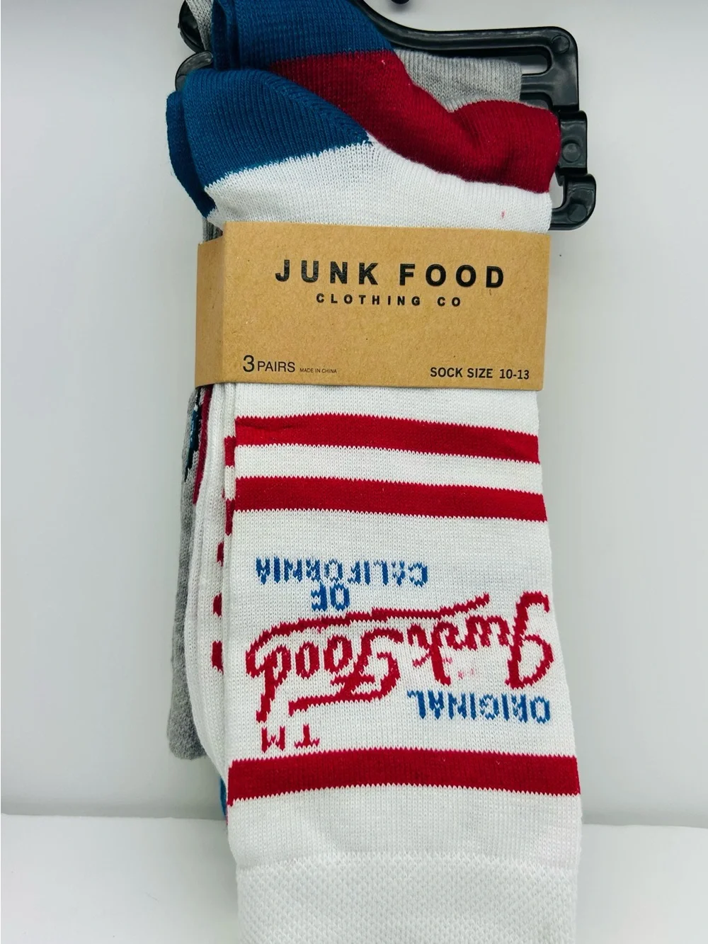 Junk Food Clothing White Crew Socks with Red Stripes and Blue Logo